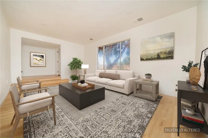Living Room (Disclaimer: Some images have been digitally enhanced with virtual staging to illustrate potential room layouts and furnishings. Actual property condition and features may vary. Buyer to verify all information independently).