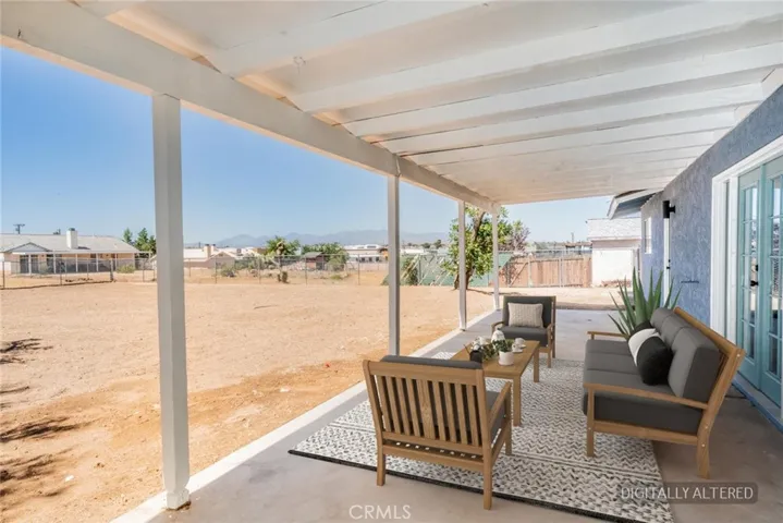 Covered Patio (Disclaimer: Some images have been digitally enhanced with virtual staging to illustrate potential room layouts and furnishings. Actual property condition and features may vary. Buyer to verify all information independently).