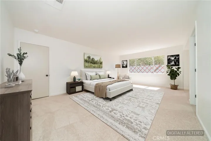 Primary Suite (Disclaimer: Some images have been digitally enhanced with virtual staging to illustrate potential room layouts and furnishings. Actual property condition and features may vary. Buyer to verify all information independently).