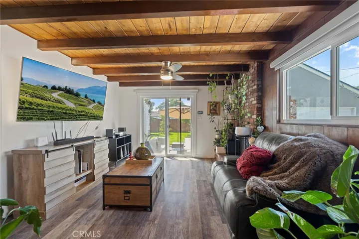 Family room opens to lush backyard