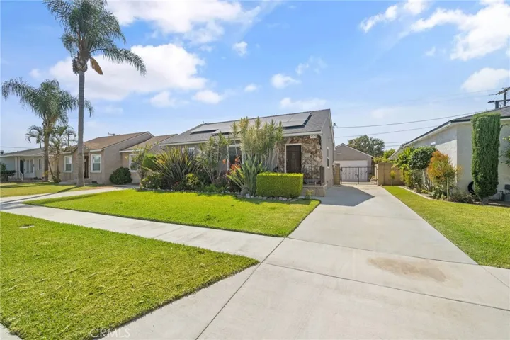 Front of home with driveway to garage