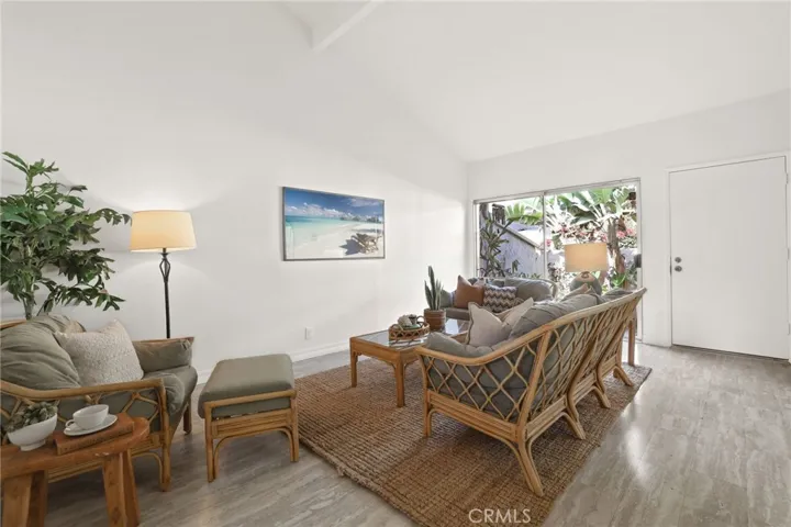 The large sliding glass door lets in lots of light coupled with the high ceilings makes this space bright and airy.
