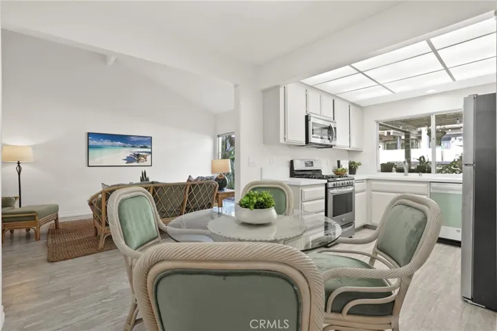 View of living room, eating area and kitchen