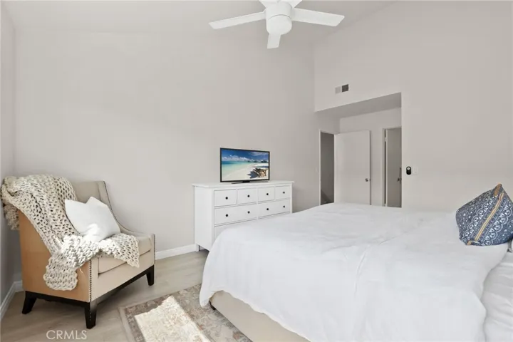 View of the entry door to the primary bedroom, en-suite and walk-in closet.