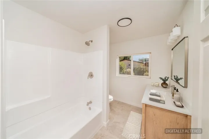 Guest Bathroom (Disclaimer: Some images have been digitally enhanced with virtual staging to illustrate potential room layouts and furnishings. Actual property condition and features may vary. Buyer to verify all information independently).