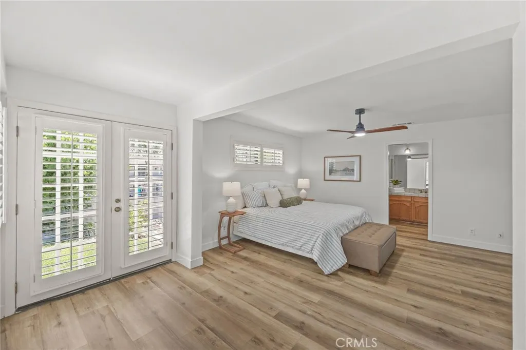 Primary bedroom w/french doors to backyard
