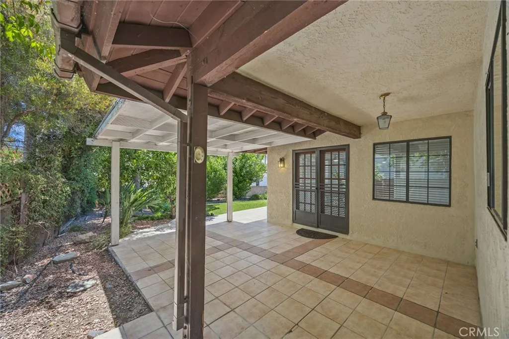 Backyard patio w/view to french doors to dining area