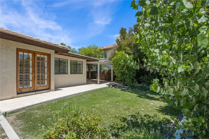 Backyard w/view of doors to master bedroom