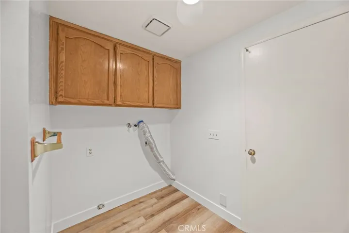 Laundry area w/storage and door to garage