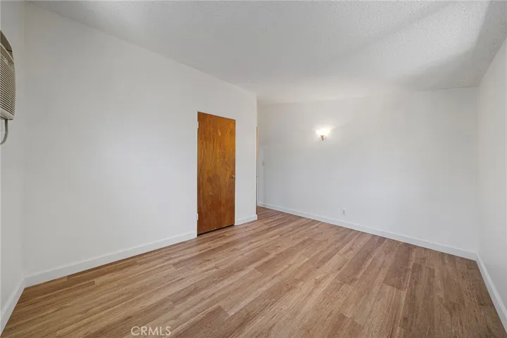 One of three bedrooms. This one is located at the front corner. Newly painted and newly installed vinyl plank flooring.