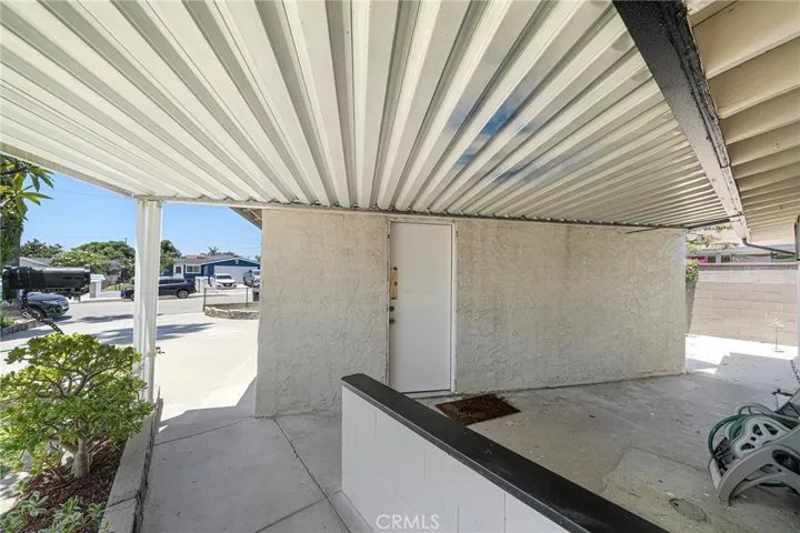 Breezeway to driveway and side door of the garage.