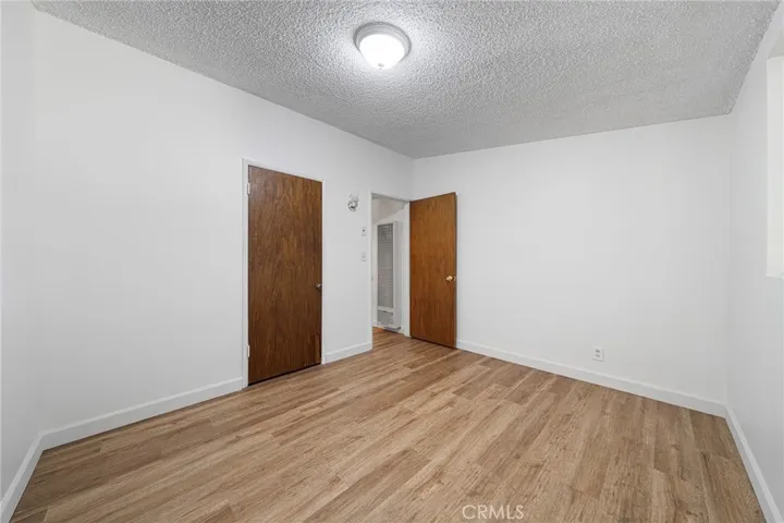 This bedroom is two of three and the first one on the left side of the hallway. Newly painted and newly installed vinyl plank flooring.