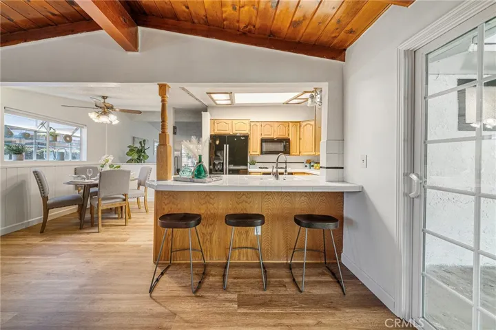 Room to dine casually at the kitchen counter. Newly painted and newly installed vinyl plank flooring.