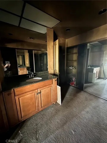 Primary bath featuring mirrored closet doors.