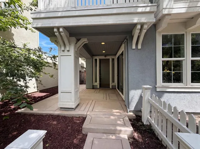 Covered porch entry featuring recessed lighting and decorative corbels