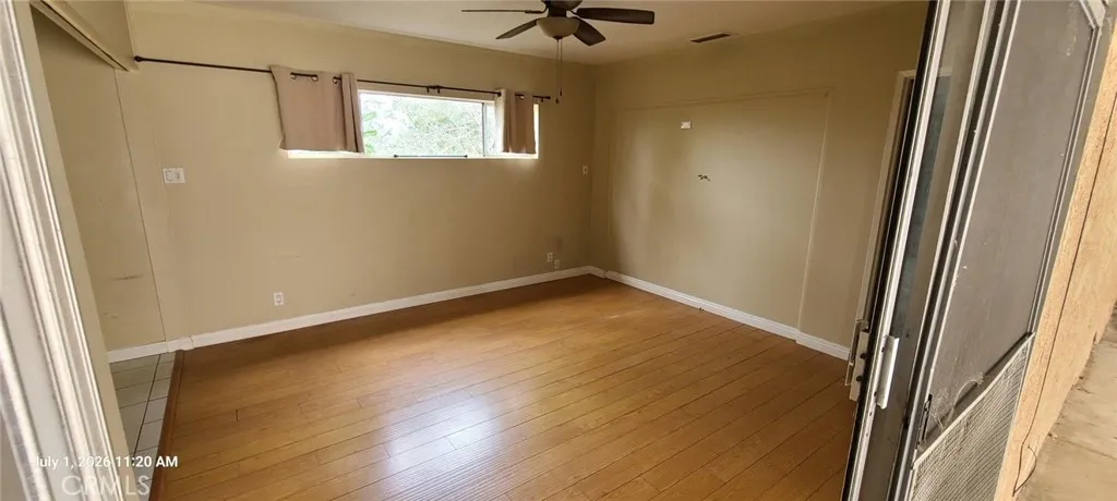 Den--off Kitchen; Slider door opens to rear covered patio.