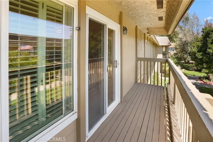Balcony with double pane window and sliding door
