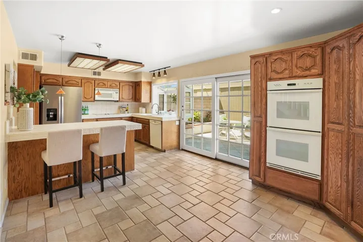 View from family room towards kitchen with breakfast counter