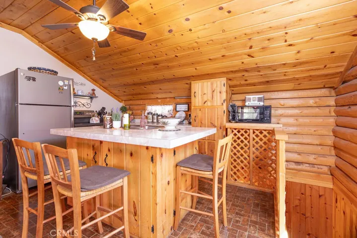 Kitchen with stairs to the right.