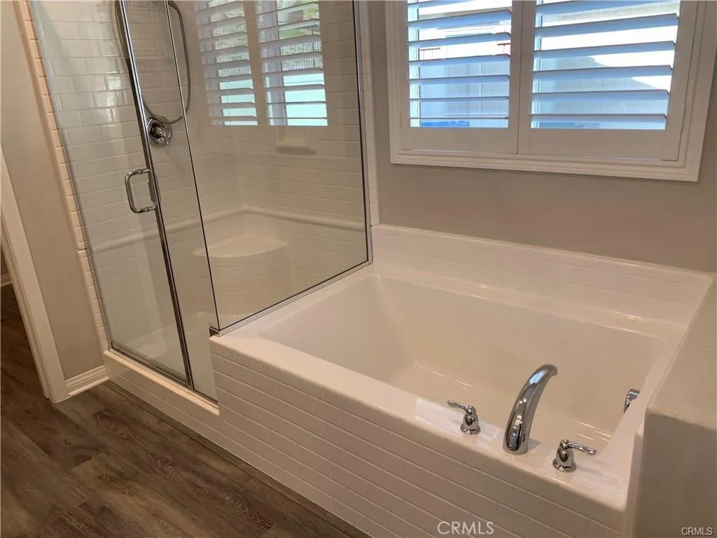 primary bathroom has shower and a tub