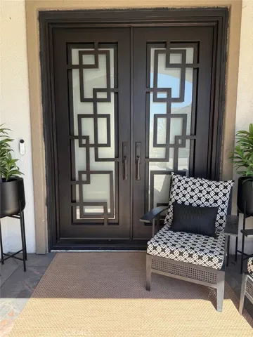Iron doors. Glass door inside opens