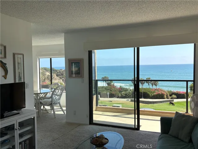 Large deck framed with glass spans entire width of​​‌​​​​‌​​‌‌​​‌​​​‌‌​​​‌​​‌‌​​‌‌​​‌‌​​​​ condo