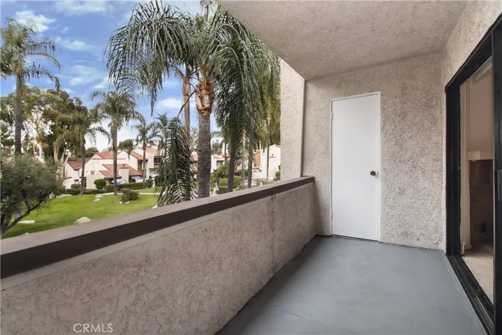 Balcony off living room with view of common areas