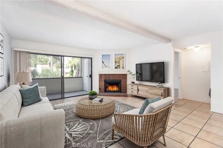 Living room and balcony with view of common areas