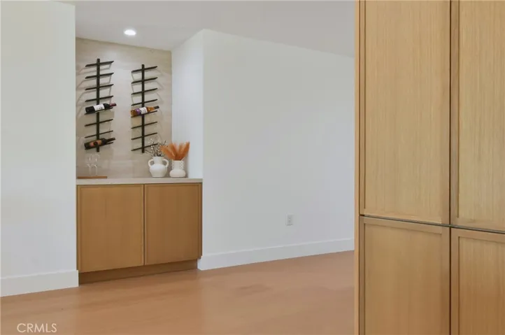 Light-filled entryway boasting clean lines, sleek flooring, and an immediate view of the spacious living areas
