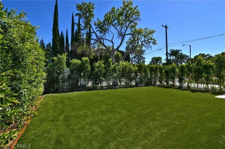 Alternative front exterior view showcasing the manicured landscaping