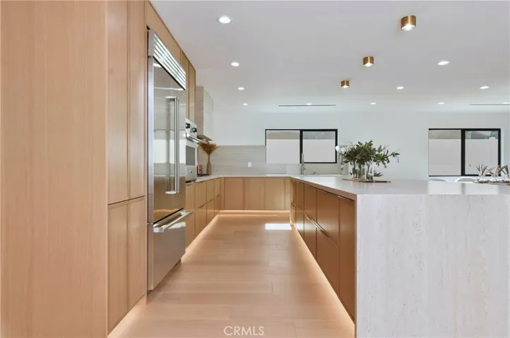 Sleek kitchen profile - seamless brand new built-in appliances and high-end, integrated custom storage solutions.