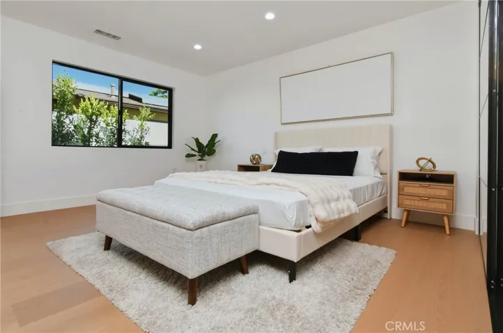 Well-appointed,spacious bedroom featuring great natural light and flexible layout potential.