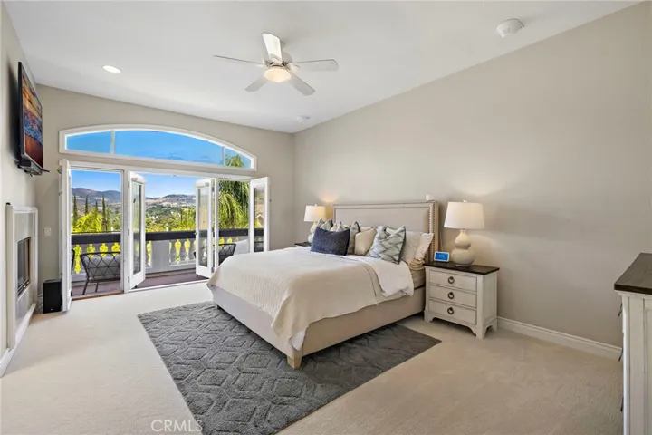 primary suite with balcony and panoramic views