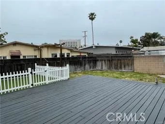 Unit 2 is cream structure behind dark fence