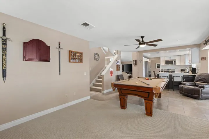 Looking towards hallway to downstairs bedroom, bath & laundry and stairs leading to the bedrooms.