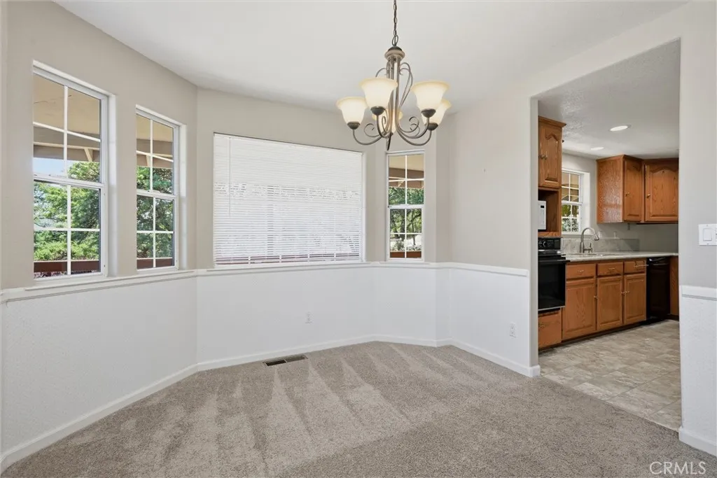 Convenient location of kitchen to dining room.  Second dining area in kitchen.  Vinyl flooring in the kitchen, canned lighting in kitchen area was installed in 2017.