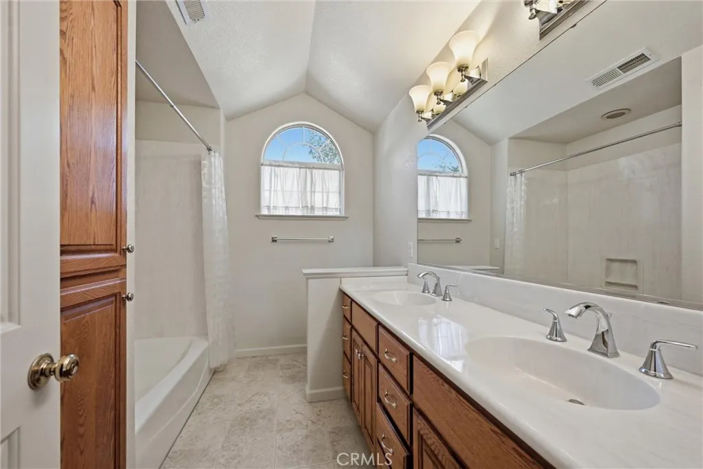 Very spacious hall bathroom.  Double sinks, combo tub and shower and lots of drawers and cabinets, natural lighting