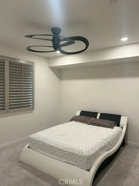 Primary Bedroom Queen Bed and Ceiling Fan