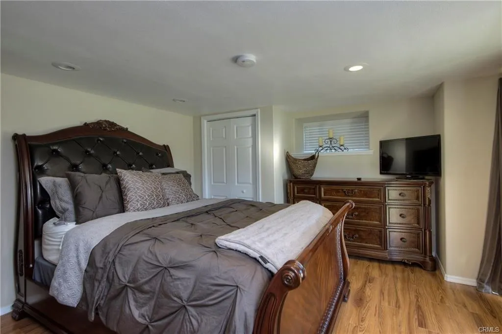 inside 1 bedroom ADU, spiral staircase to bedroom with slider