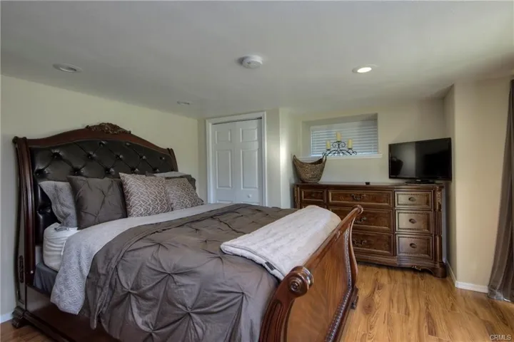 inside 1 bedroom ADU, spiral staircase to bedroom with slider