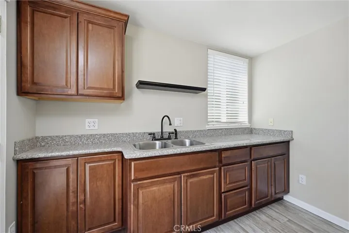 room in back of commercial with sink , could add stove and Refrigerator