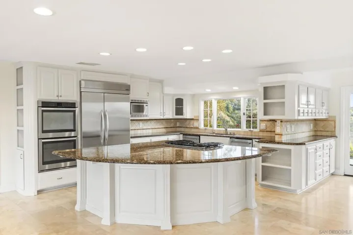 Newly painted cabinets, 2-dishwashers, large kithen island with wine cabinet