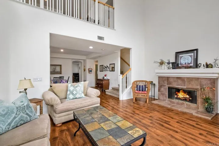 The spacious formal living room is perfect for entertaining or relaxing with natural light