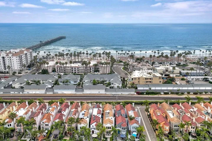 Experience refined coastal living in this charming beachside residence, just steps from the sand