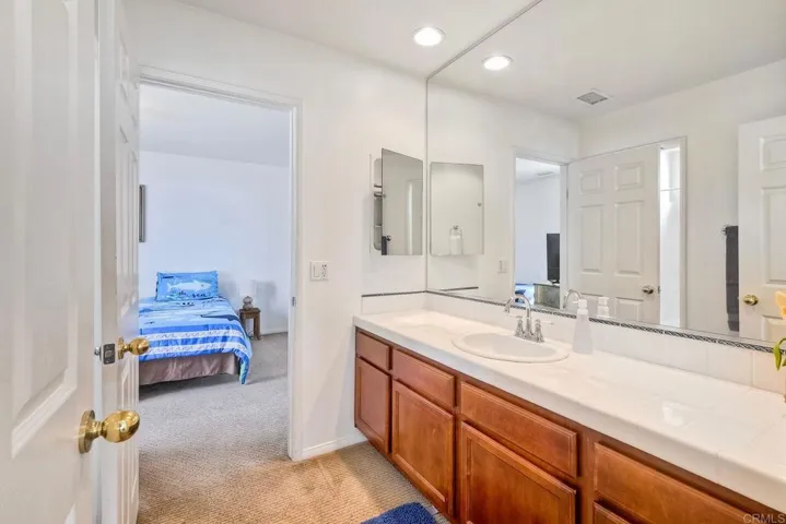 Spacious counter and easy dressing area in main bath