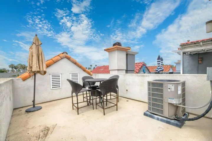 The rooftop deck is perfect for sunbathing, relaxing, or enjoying a a peak of the ocean