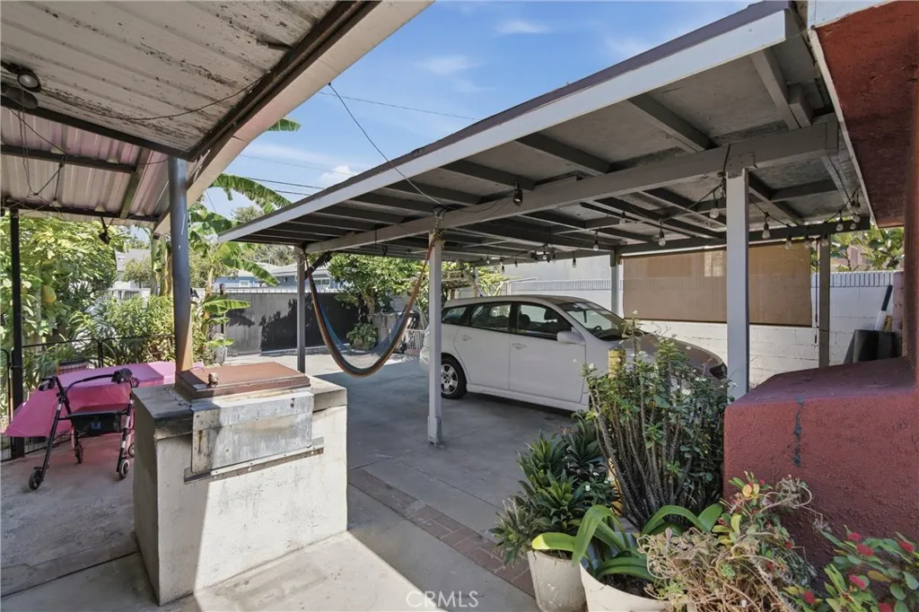 View of cover patio & tandem parking for two cars