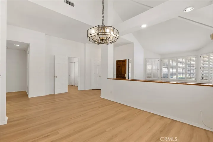 Front dining room open to living room and entry