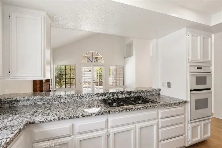 Kitchen facing 2nd living room and backyard