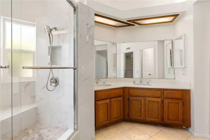 Primary bathroom view from closet